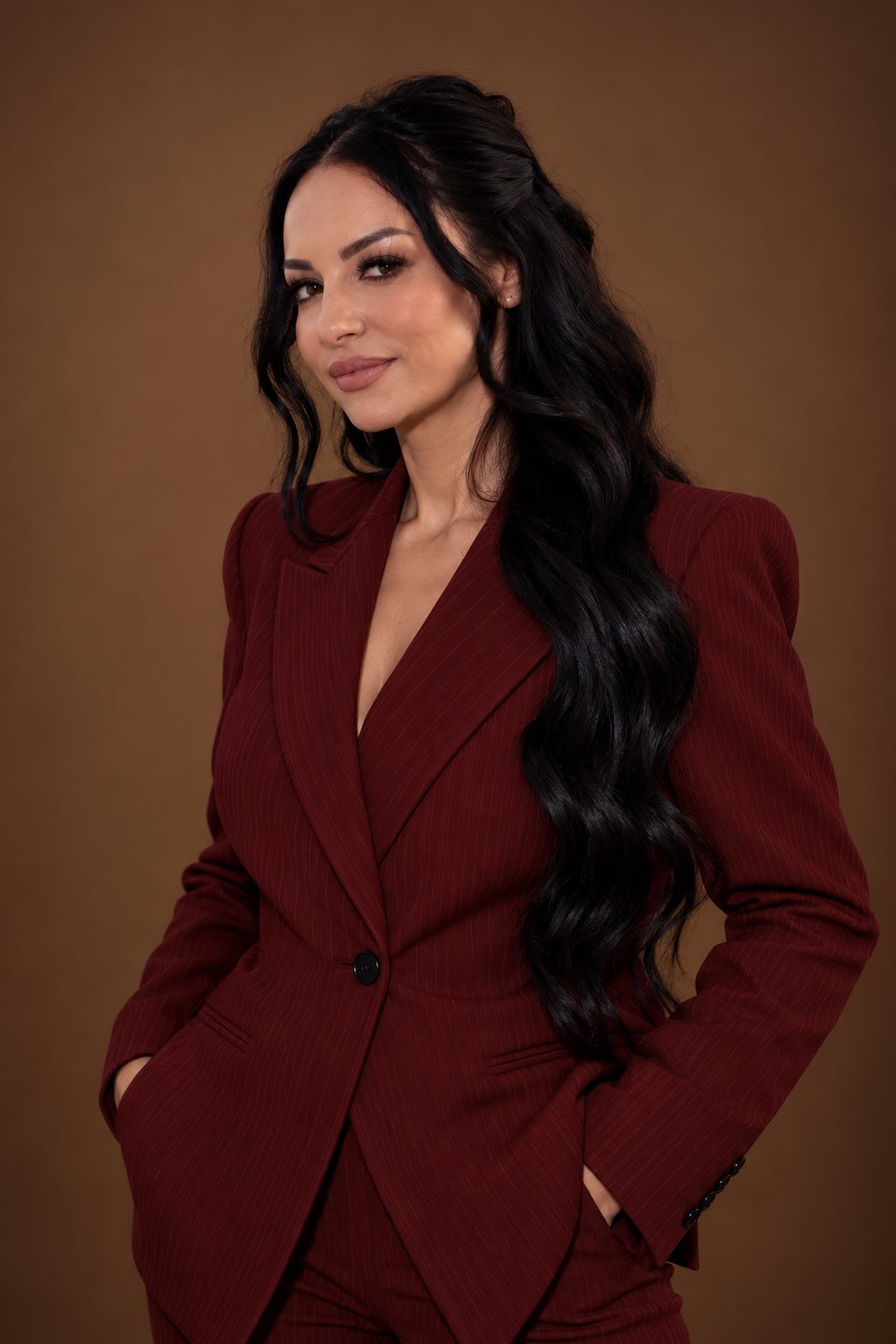 Coach Marcy in a burgundy pinstripe suit